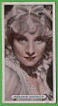 The cigarette cards in the set are :1 Gary Cooper , 2 Maurice Chevalier , 3 Claudette Colbert , 4 Marlene Dietrich , 5 Marlene Dietrich ,  6 Brigitte Helm , 7 Dollt Haas , 8 Renate Muller , 9 Anny Ondra , 10 Sylvia Sidney , 11 Conrad Veidt , 12 Mae West ,  13 Mae West , 14 George Arliss , 15 Richard Barthelmess ,  16 John Barrymore ,  17 George Bankroft , 18 Clive Brook ,  19 Mary Carlisle ,  20 Ronald Coleman ,  21 James Cagney , 22 Nancy Carroll ,  23 Douglas Fairbanks , 24 Charles Farrell , 25 Kay Francis ,  26 Clark Gable , 27 Charles Laughton , 28 Carole Lombard , 29 Jeanette MacDonald , 30 Fredric March , 31 Marion Nixon , 32 Jack Oakie , 33 Merle Oberon , 34 Zasu Pitts , 35 George Raft, 36 Charles Rogers , 37 Helen Twelvetrees ,  38 Loretta Young , 39 Elisabeth Bergner , 40 Lew Ayres , 41 Cary Grant, 42 Lillian Harvey, 43 Anna May Wong , 44 Ramon Novarro , 45 Myrna Loy , 46 Wallace Beery,  47 Constance Bennett, 48 Douglas Fairbanks , 49 Joan Crawford , 